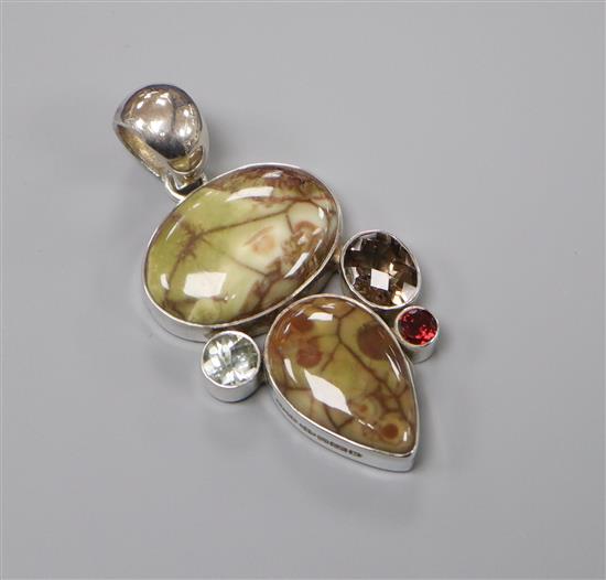 A 2009 Pruden and Smith silver, hardstone and gem set pendant, 52mm.